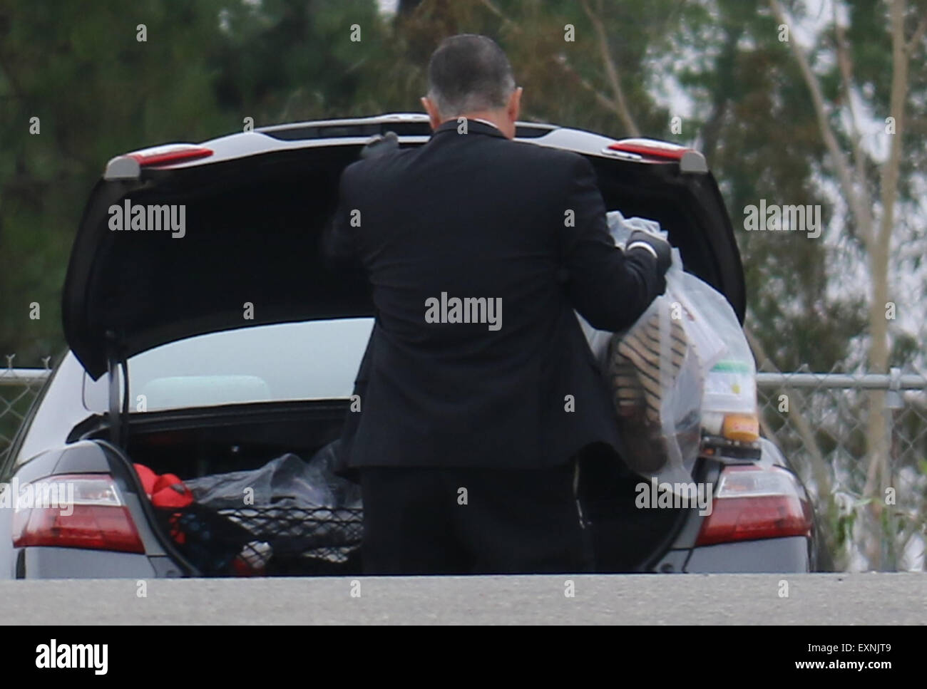 Tarzana, California, USA. 15th July, 2015. LAPD investigators gather evidence at the scene were three masked men, one armed with a pistol, stormed into Chris Brown's Tarzana home early this morning, put a female relative in a closet, trashed the residence and stole a variety of items. The home-invasion occurred about 2 a.m. in the 19600 block of Citrus Ridge Drive, police said. Credit:  Gene Blevins/ZUMA Wire/Alamy Live News Stock Photo