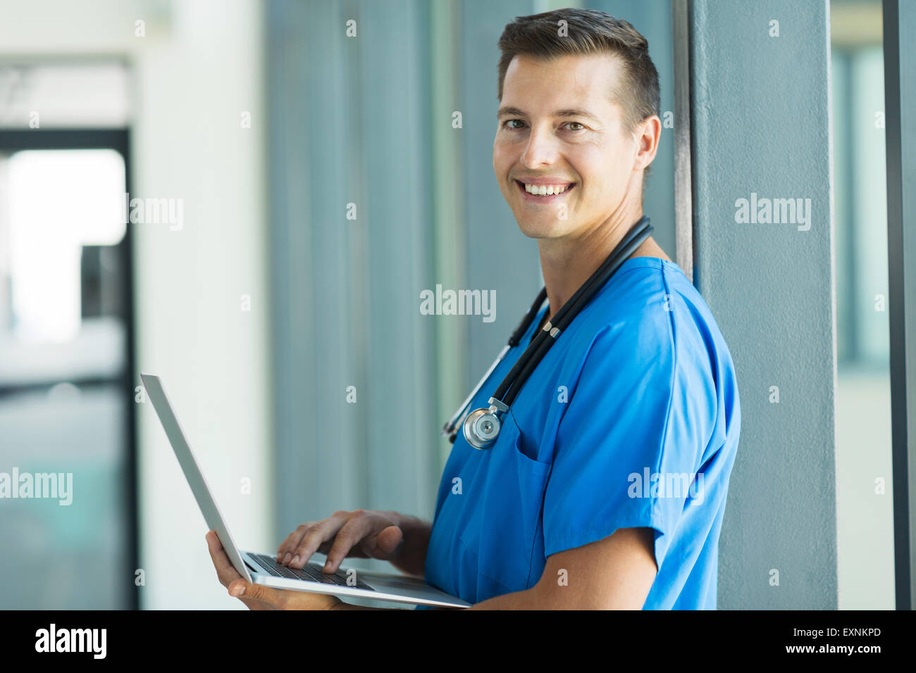 portrait of young nurse working on a laptop Stock Photo