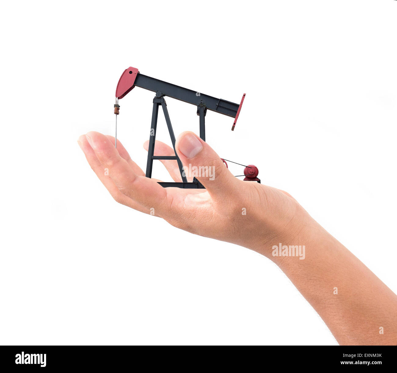 hand hold pumpjack isolated on white background Stock Photo