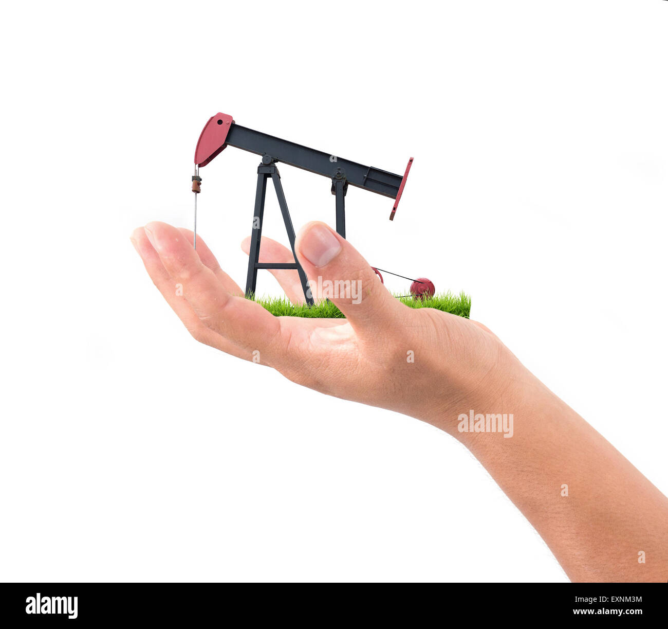 hand hold pumpjack isolated on white background Stock Photo