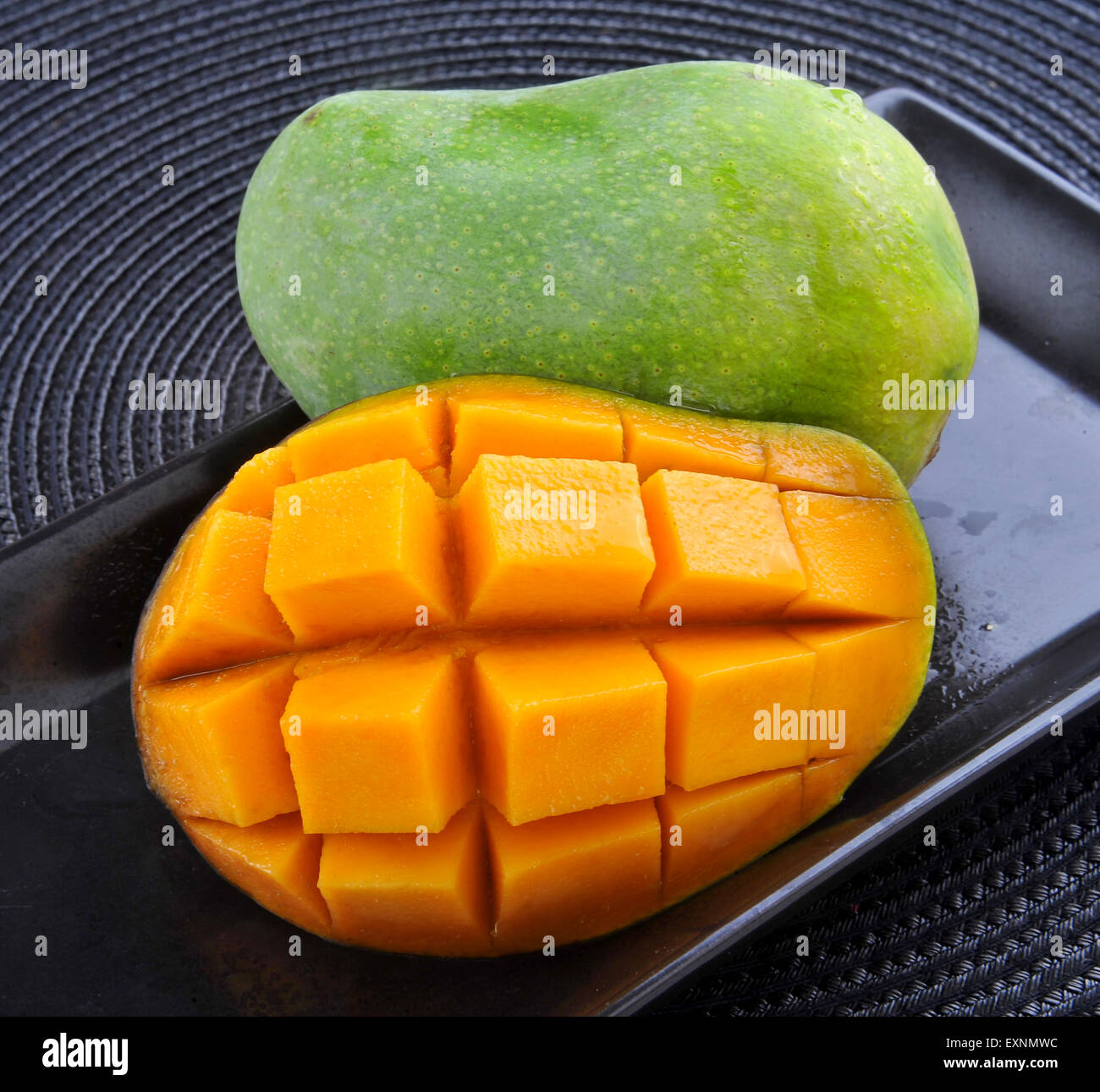 mango-in-black-dish-stock-photo-alamy