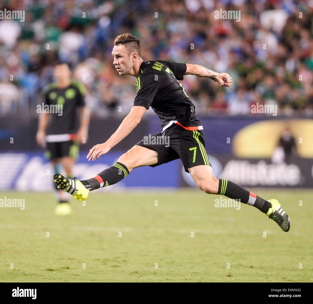 Charlotte, North Carolina, USA. 15th July, 2015. Mexico defender Miguel Layun (7) watches his kick sail over the goal post during the 2015 CONCACAF Gold Cup Group C match between Mexico and Trinidad & Tobago at Bank of America Stadium in Charlotte, North Carolina. PJ Ward-Brown/Cal Sport Media/Alamy Live News Stock Photo