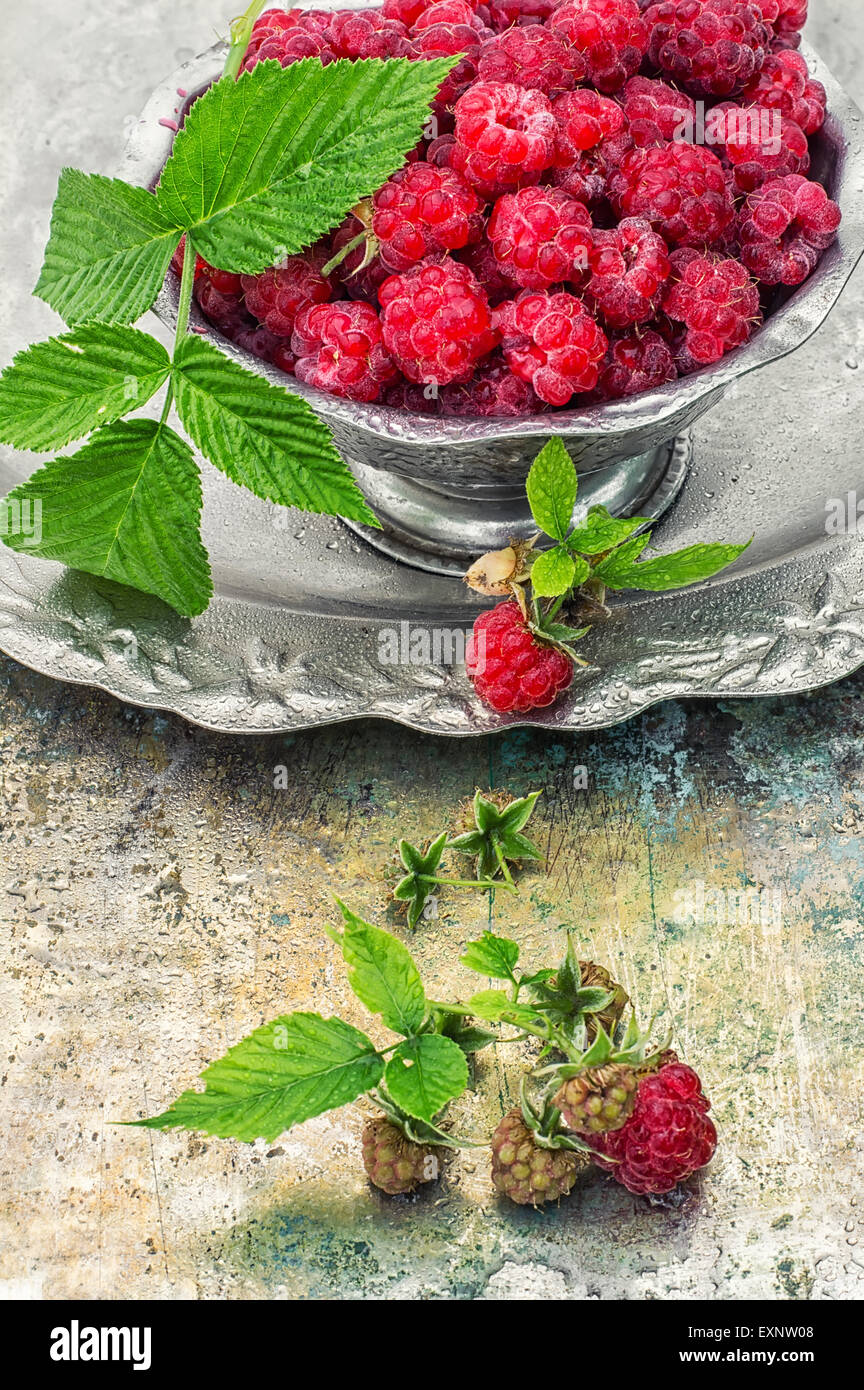 Yummy Iron Raspberry Plucked raspberries in vintage iron ramekin.Photo tinted.Selective ...