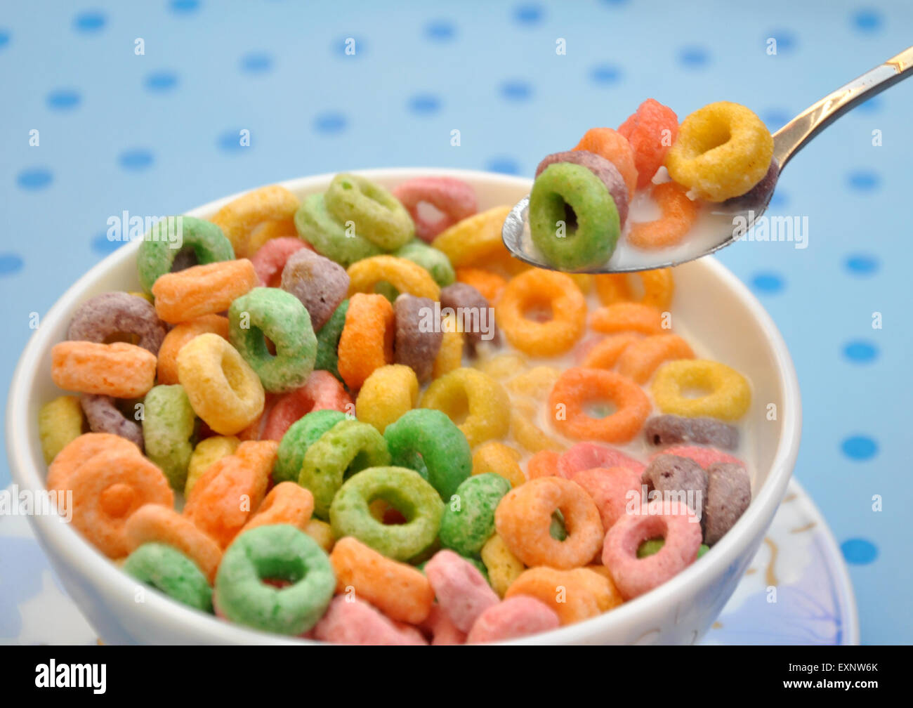 Free Photo  Coloured fruity loops and milk on pink background