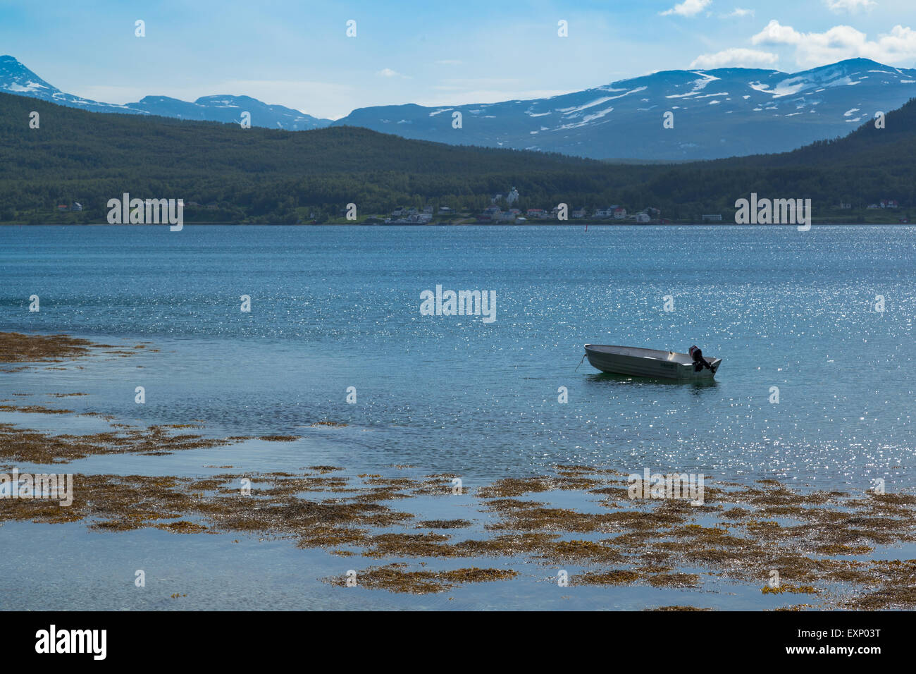 Small boat left alone in the blue fjords of Norway Stock Photo - Alamy