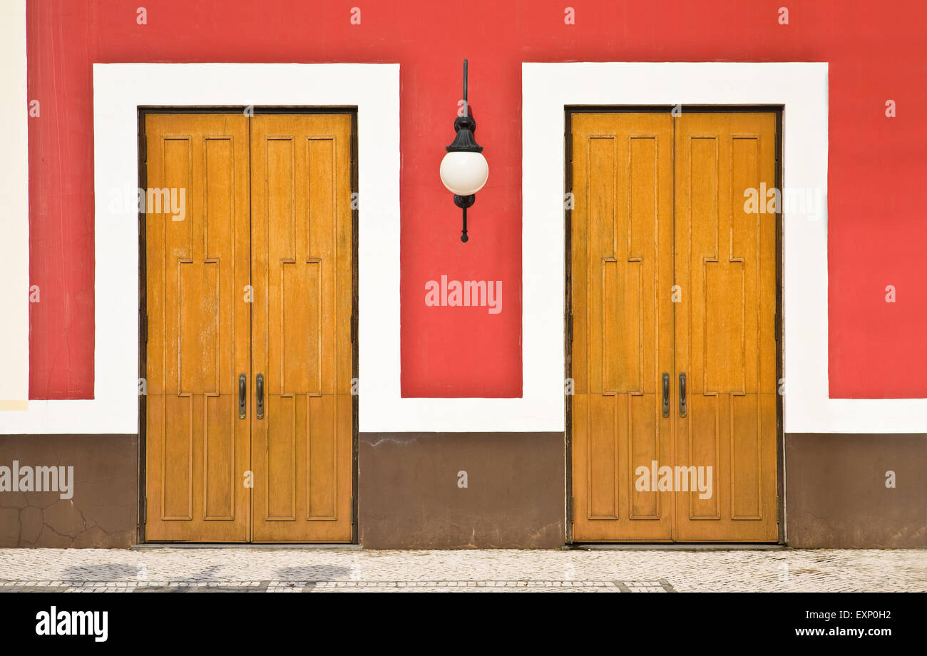Two doors against color wall Stock Photo