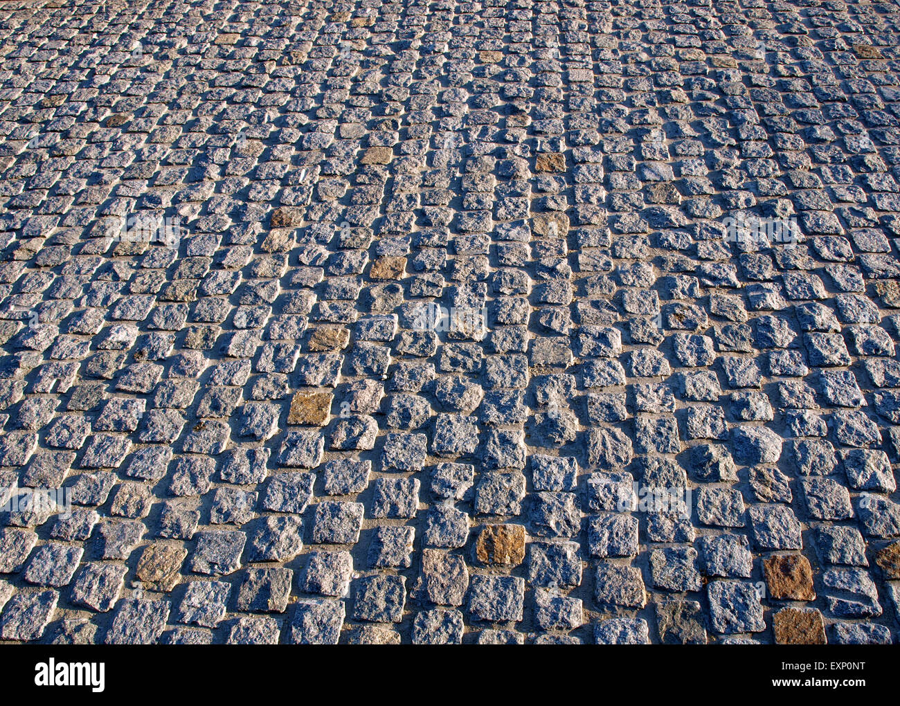 Old road pavement of the small rough granite tiles Stock Photo Alamy