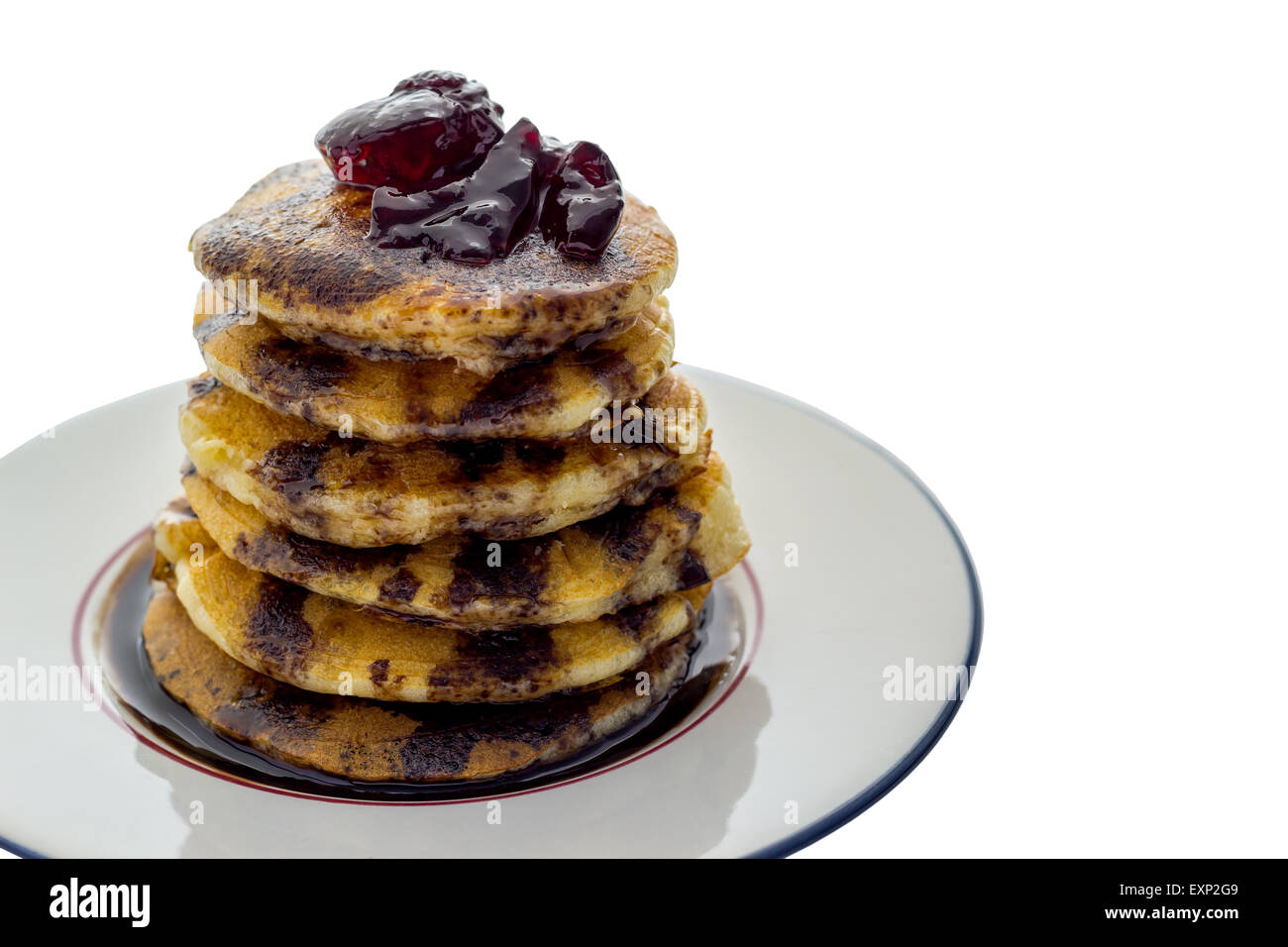 Pancakes with jelly toping on white saucer Stock Photo