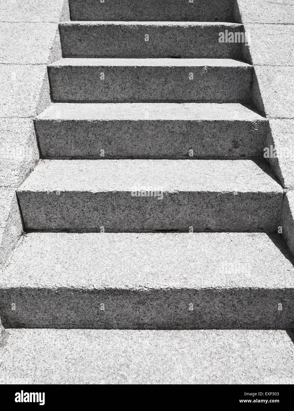 Stairs made of gray granite stone goes up, perspective view Stock Photo