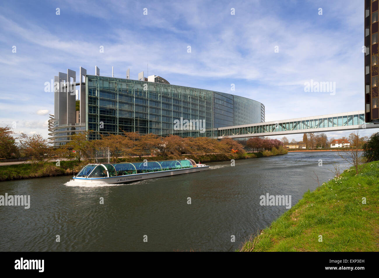 European Parliament with the crossing of the ILL, an excursion boat in front, Eurodistrict, Strasbourg, Alsace, France Stock Photo