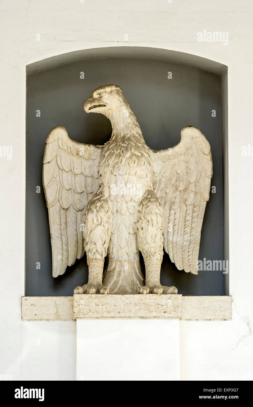 Stone imperial eagle next to the portal of the Heilig-Geist-Spital hospital, Augsburg, Swabia, Bavaria, Germany Stock Photo