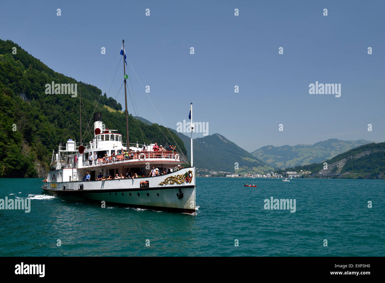 Salon side wheel steamer Schiller with the village of Brunnen behind, Lake Lucerne, Canton of Schwyz, Switzerland Stock Photo