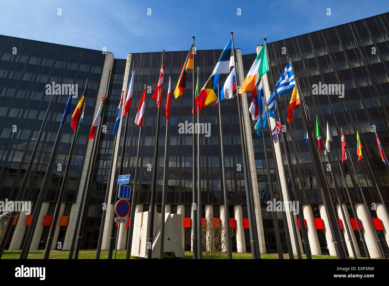 International flags in front of a building in the Eurodistrict, Strasbourg, Alsace, France Stock Photo