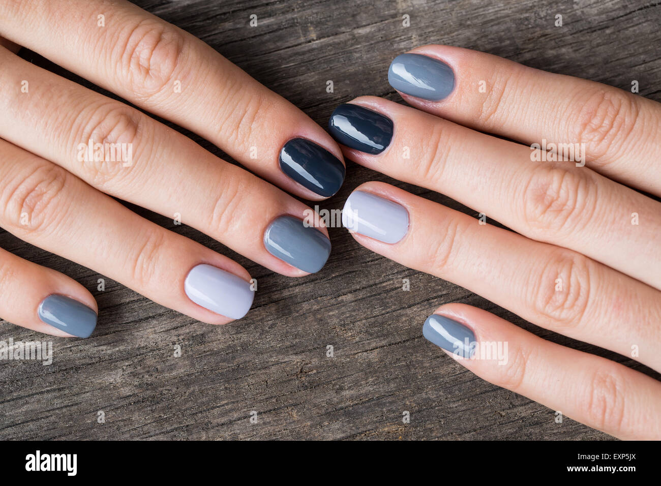 Beautiful hands with the miniature painted in a gray-colored Stock Photo