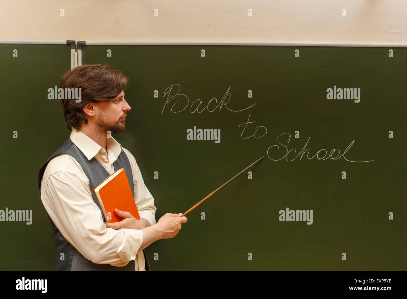 Teacher Book Inscription The teacher shows the inscription on the back to school. The ...