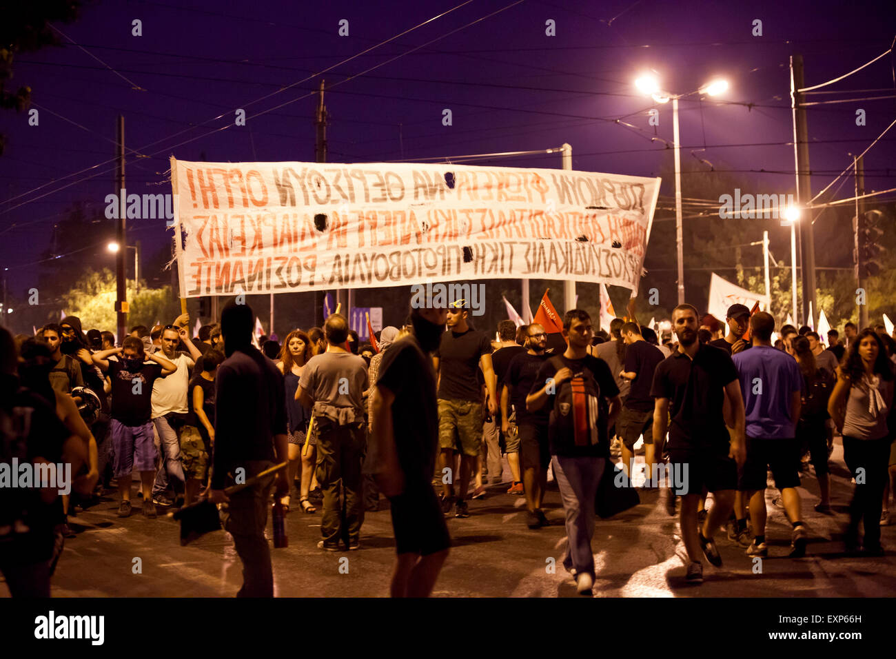 Athens, Greece. 15th July, 2015. Anarchists clash with riot police outside in Athens while the 3rd bailout deal is being voted for inside the Greek Parliament. Credit:  Martin Garnham/Alamy Live News Stock Photo