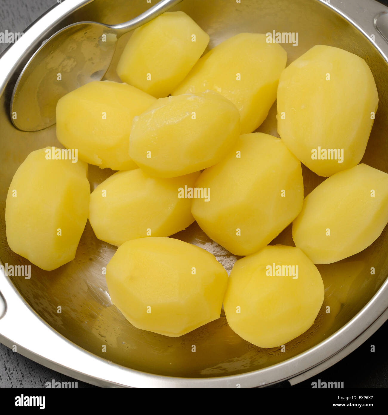 Boiled potatoes in a steel bowl Stock Photo Alamy
