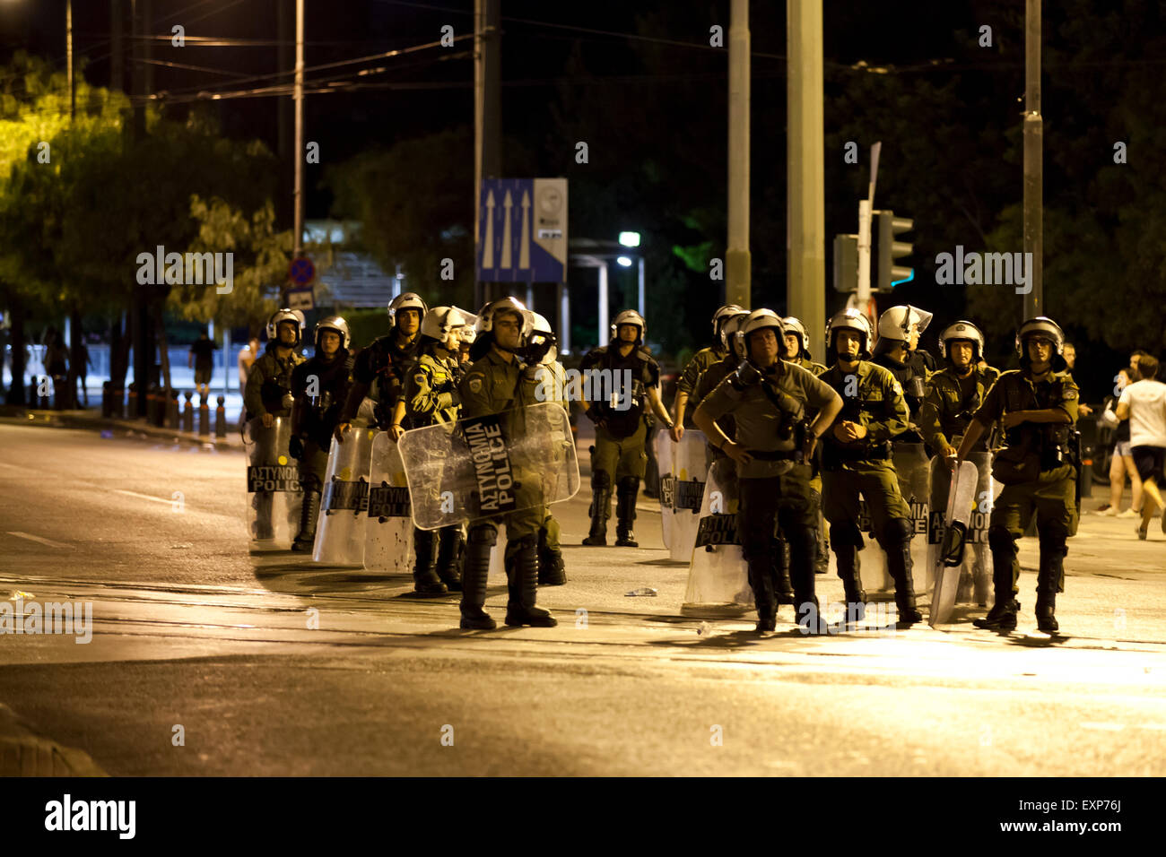 Athens, Greece. 15th July, 2015. Anarchists clash with riot police outside in Athens while the 3rd bailout deal is being voted for inside the Greek Parliament. Credit:  Martin Garnham/Alamy Live News Stock Photo