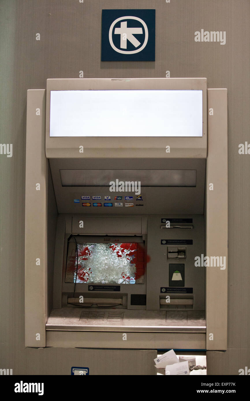 Athens, Greece. 15th July, 2015. ATM Damage caused by Anarchists during the Anti austerity protests in Athens while the 3rd Bailout vote is duscussed in the Greek Parliament. Credit:  Martin Garnham/Alamy Live News Stock Photo
