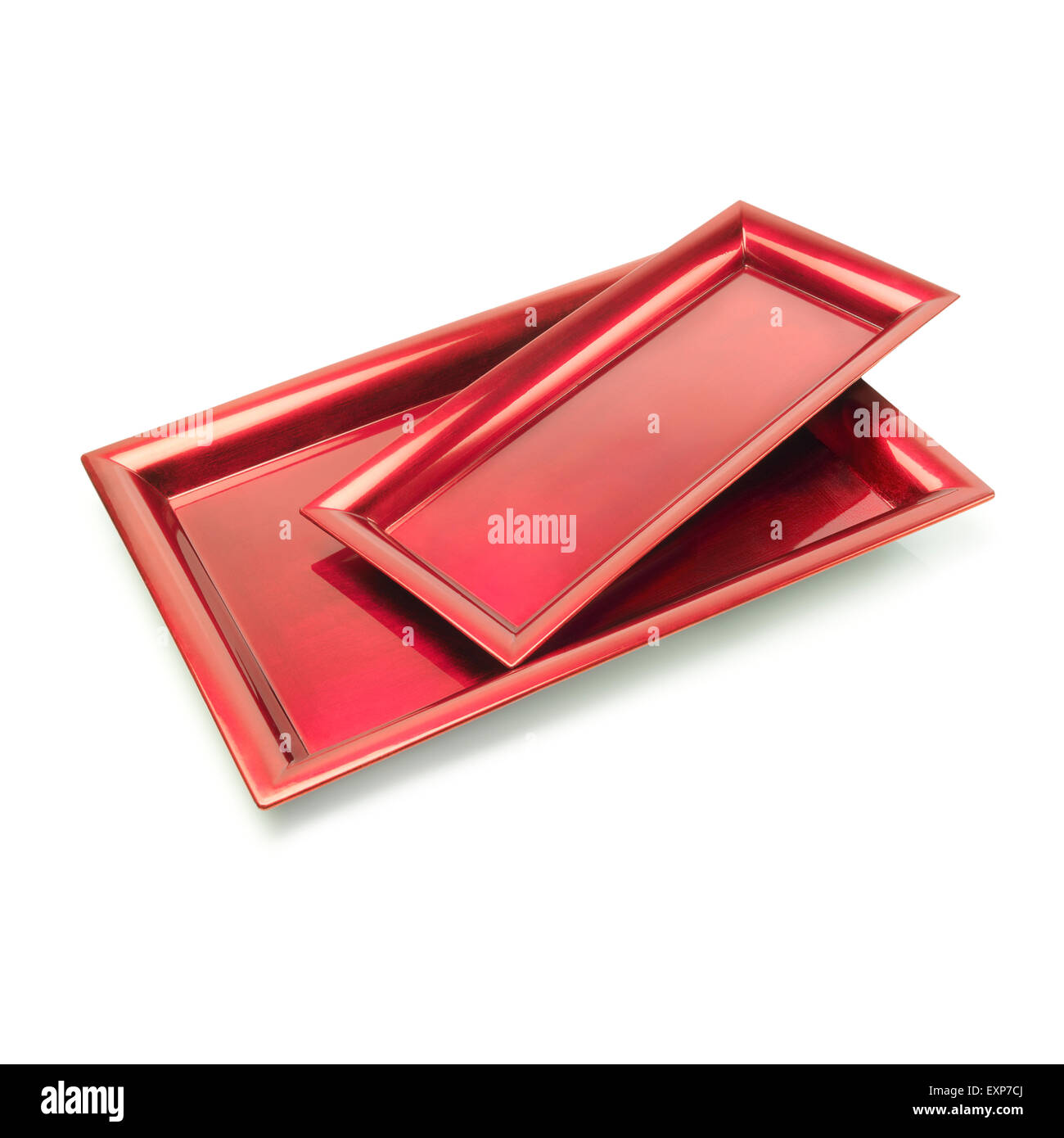 Two red color trays against white background. Clipping path Stock Photo