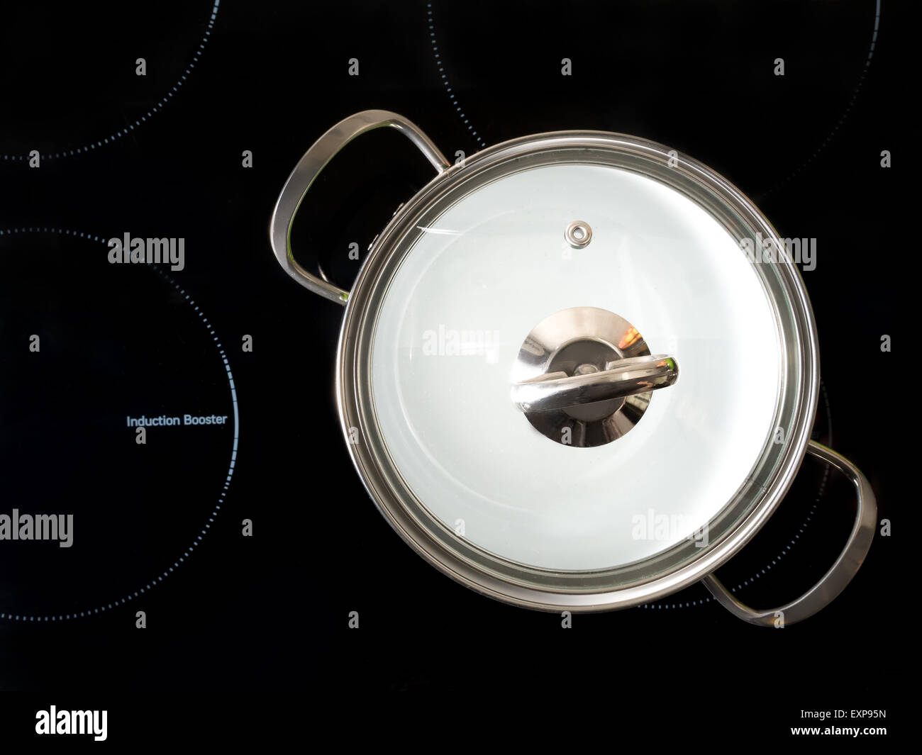 Stewpot on black induction cooker shot from above Stock Photo