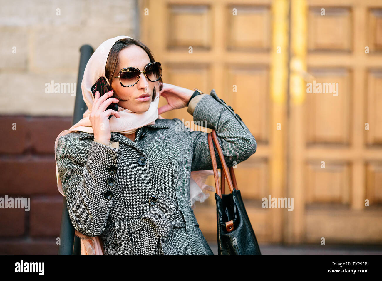 girl in a coat on the street Stock Photo - Alamy