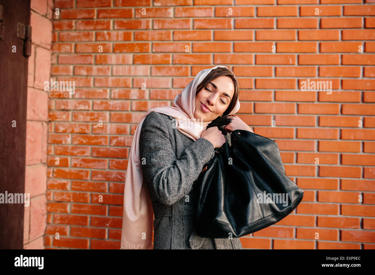 girl in a coat on the street Stock Photo - Alamy