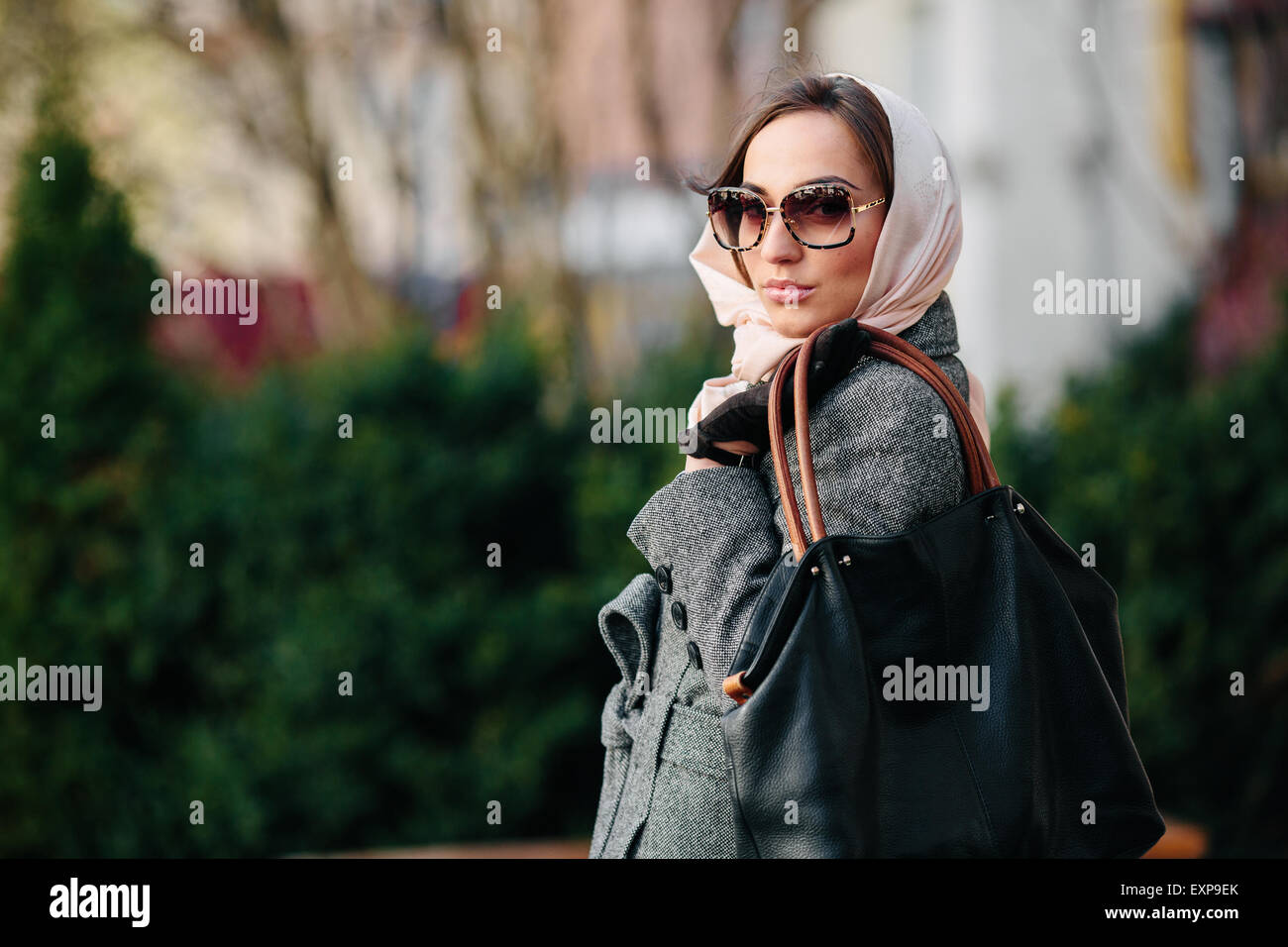 Happy young beautiful girl posing in the park Stock Photo - Alamy