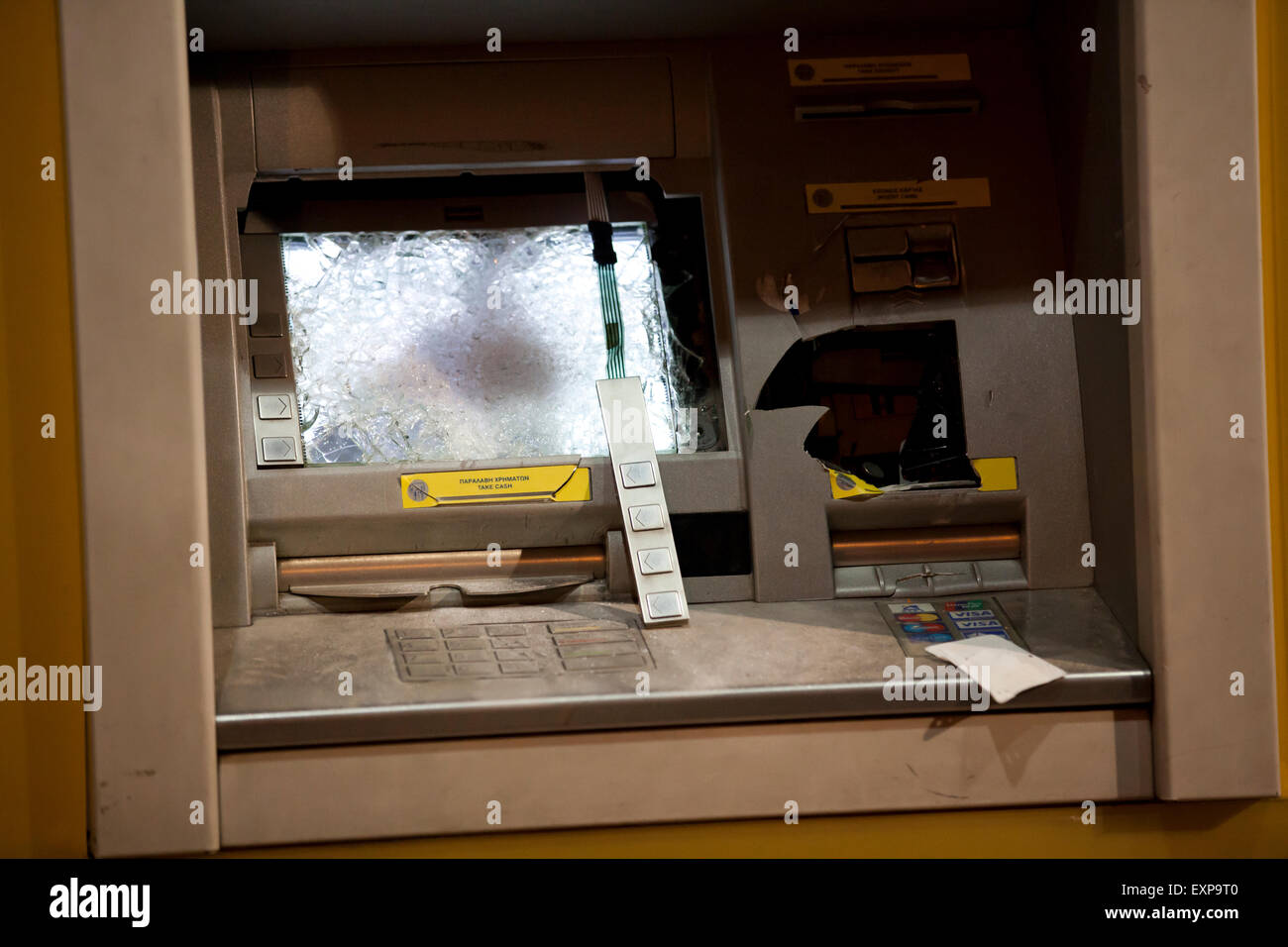 Athens, Greece. 15th July, 2015. ATM Damage caused by Anarchists during the Anti austerity protests in Athens while the 3rd Bailout vote is discussed in the Greek Parliament. Credit:  Martin Garnham/Alamy Live News Stock Photo
