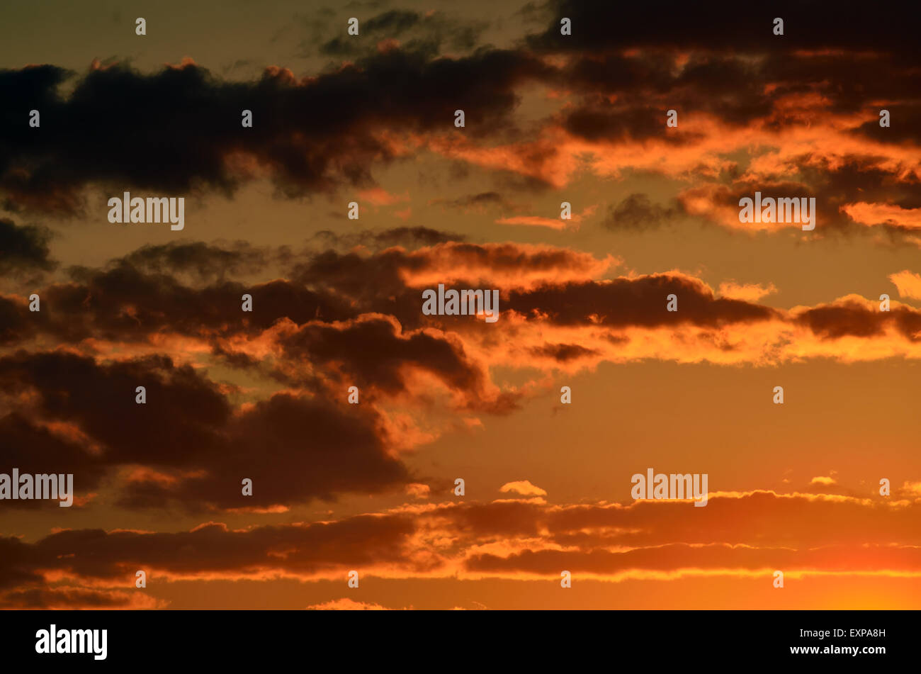 Heavenly landscape with dramatic crimson sunset clouds Stock Photo - Alamy