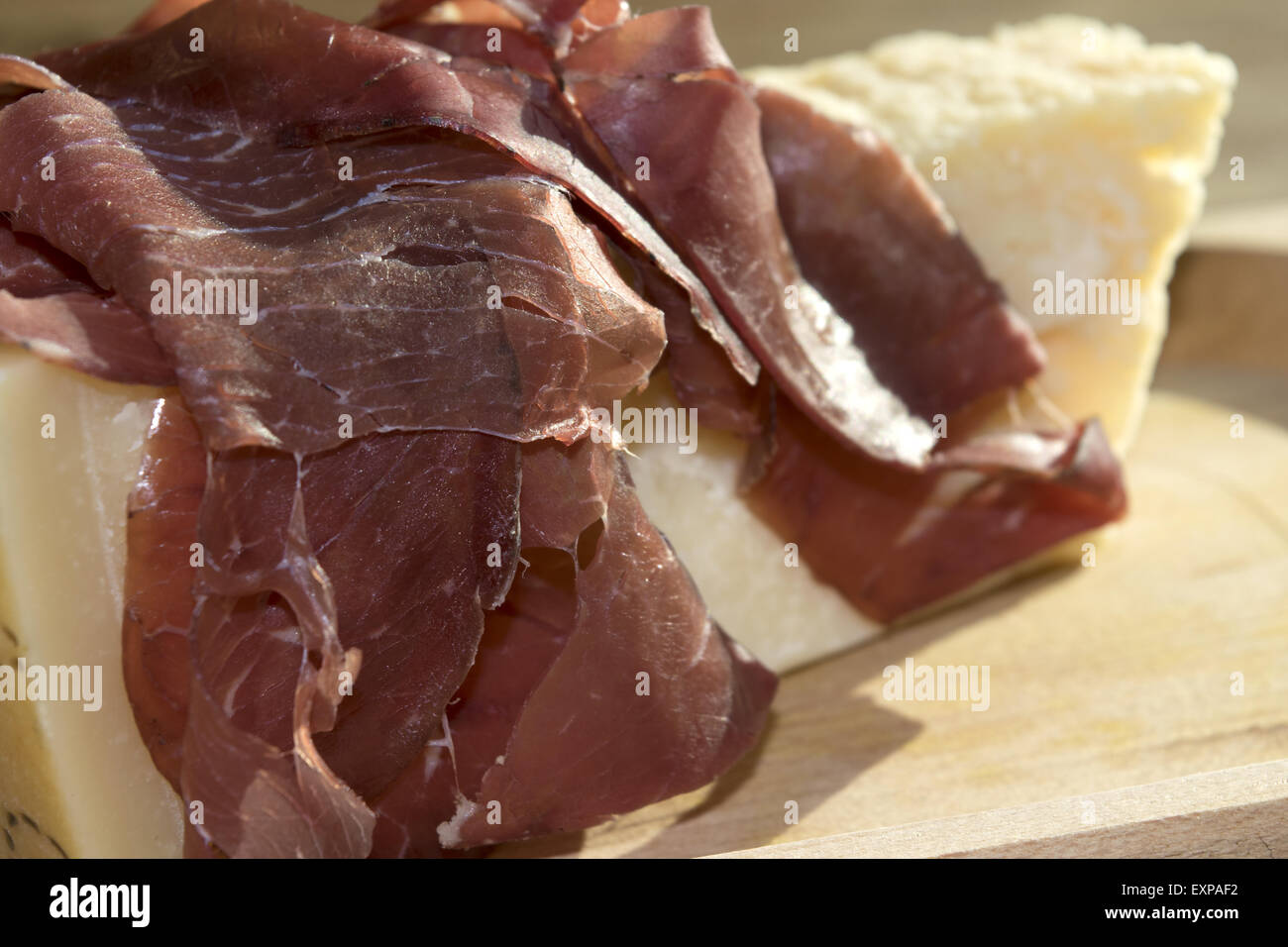 italian appetiser and second course: bresaola and parmesan Stock Photo