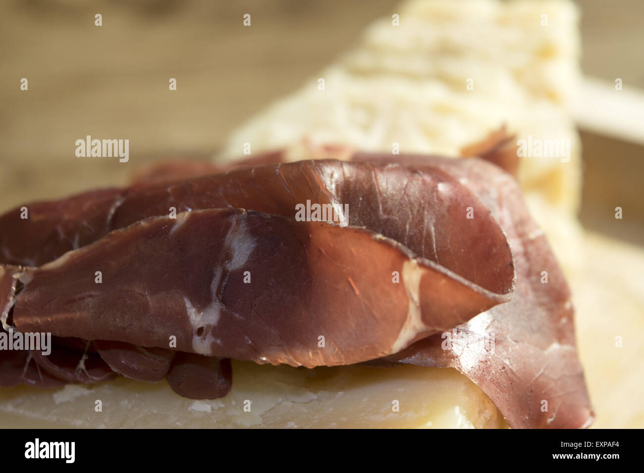 italian appetiser and second course: bresaola and parmesan Stock Photo