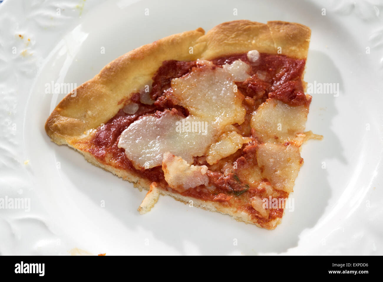 wedge of homemade margherita pizza on a white dish Stock Photo