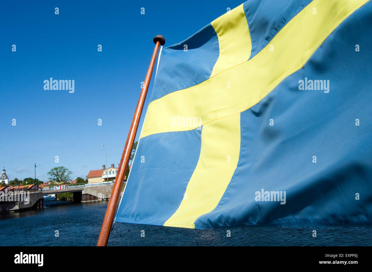 swedish sweden flag flags summer time blue sky Scandinavian cross Sveriges Flagg Sverige Stock Photo