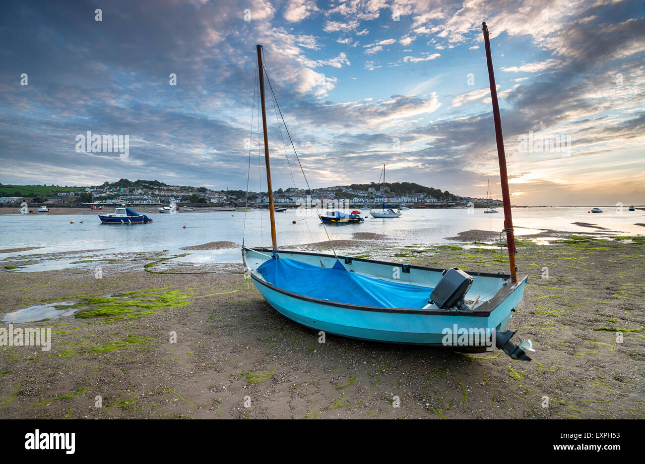 A sailing boat on the beach at Instow, looking out to Appledore across the bay Stock Photo