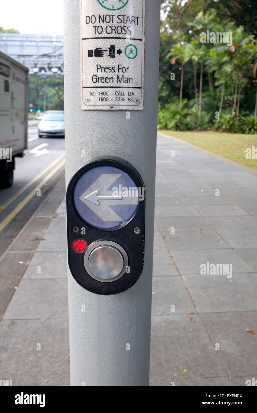 Arrow and button to press for Pedestrian Crossing Stock Photo