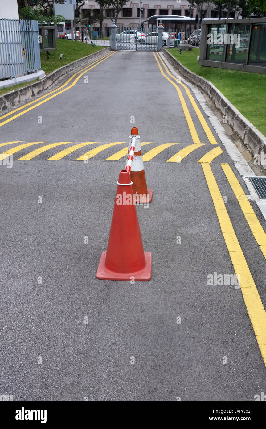 Red cones and yellow striped warning road Stock Photo