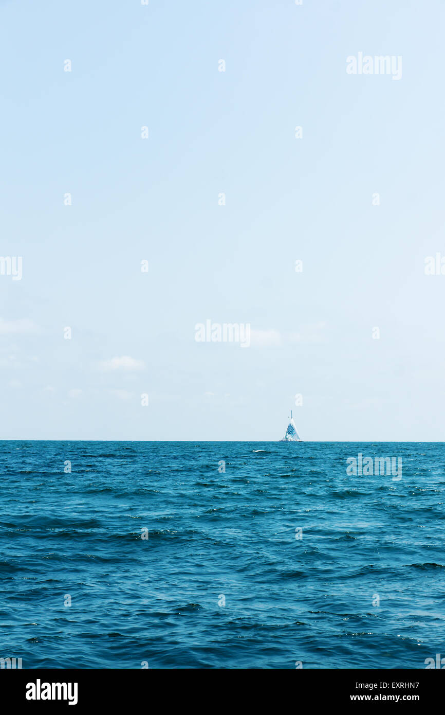 small vessel on sea open spaces under a salty wind Stock Photo