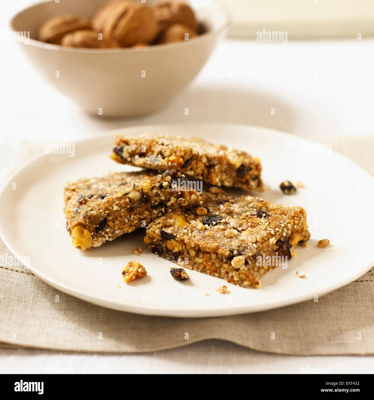 Currant and walnut muesli bars on a plate Stock Photo