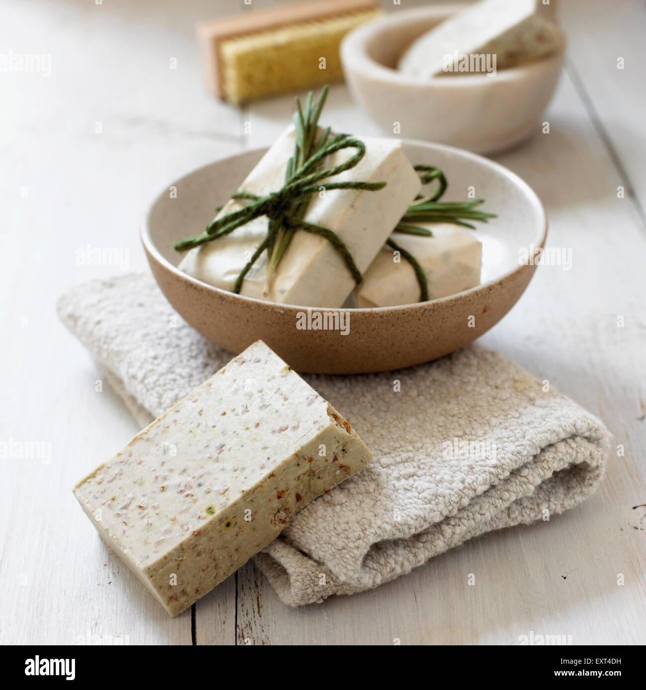 Rosemary soap in a bowl and on towel, close-up Stock Photo