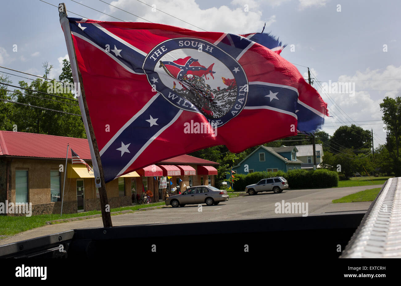 A confederate flag is seen flying off the bed of a pickup truck in Townsend, Tennessee. Stock Photo