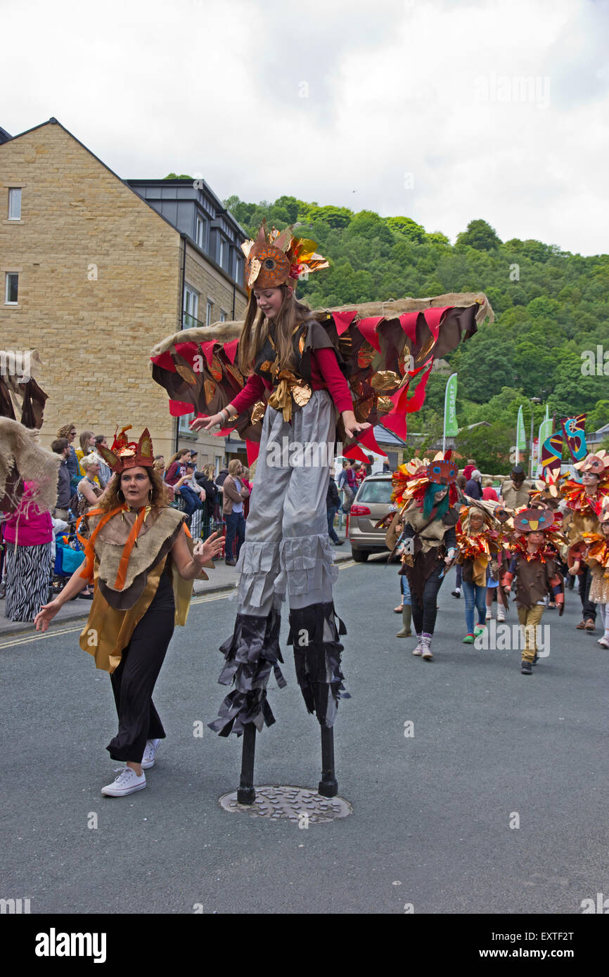 Stilt walker in Hebden Bridge Handmade Parade, 7th June 2015 Stock Photo