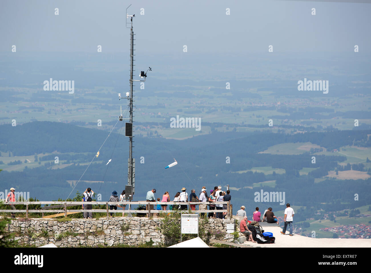 Visitors at a viewing platform from mountain top in Bavaria Stock Photo
