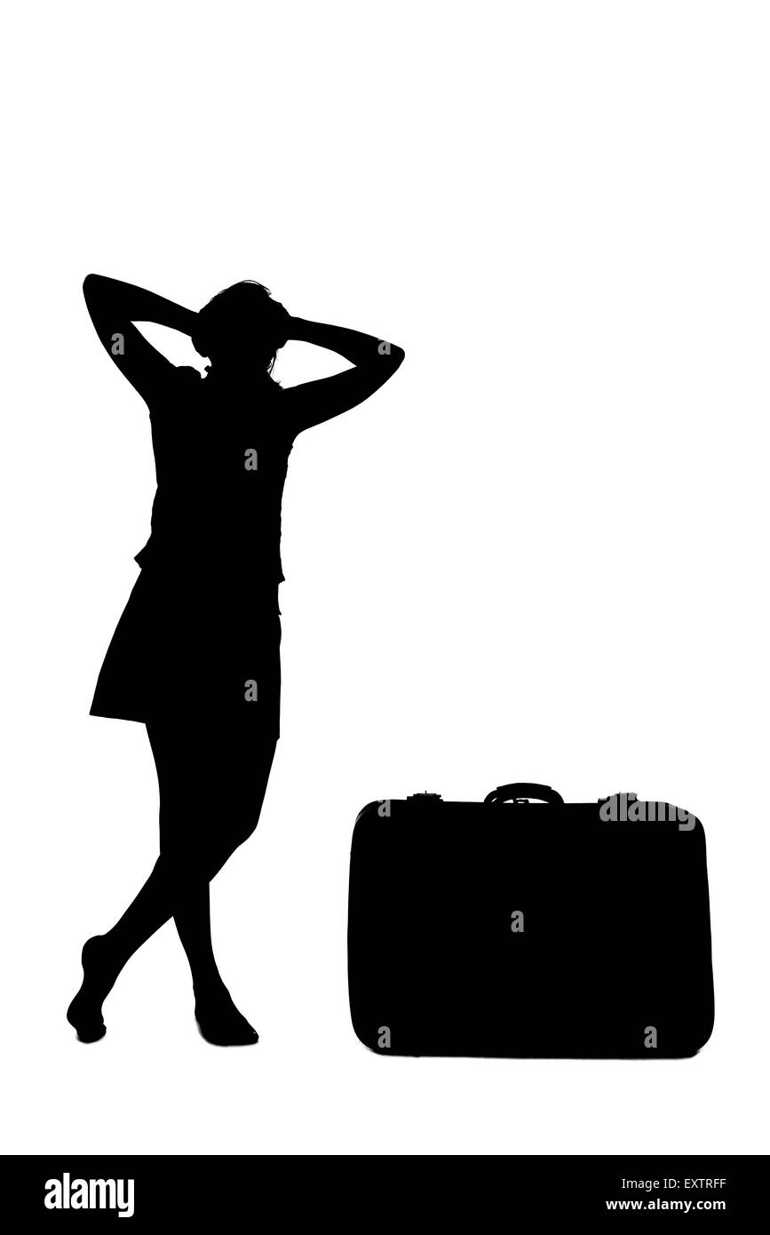 stressed woman silhouette - near a luggage Stock Photo