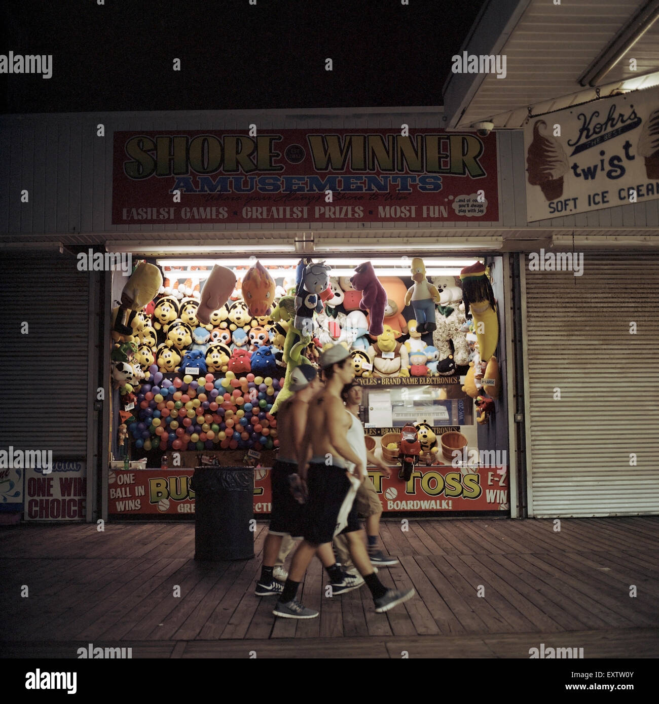 Group of Boys walk by Games on the boardwalk on August 13, 2013 in Seaside Heights New Jersey. Stock Photo