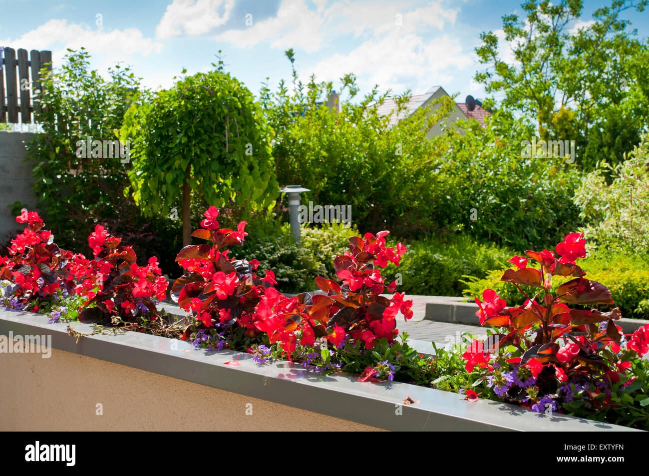 balcony building house flower flowers garden city green home europe sky blue villa white assos beautiful spring town mediterrane Stock Photo