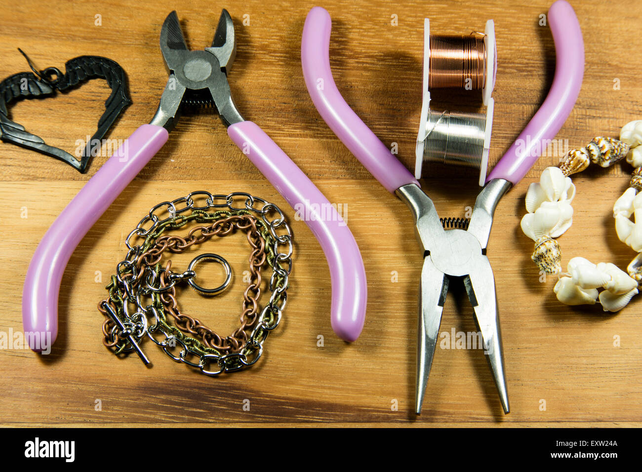 Various craft tools used to make jewelry from wire and beads Stock