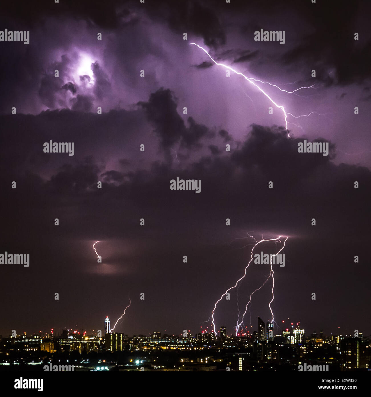 London, UK. 17th July, 2015. UK Weather: Lightning Strikes over central London. Taken from Surrey Quays towards Southbank. Credit:  Guy Corbishley/Alamy Live News Stock Photo