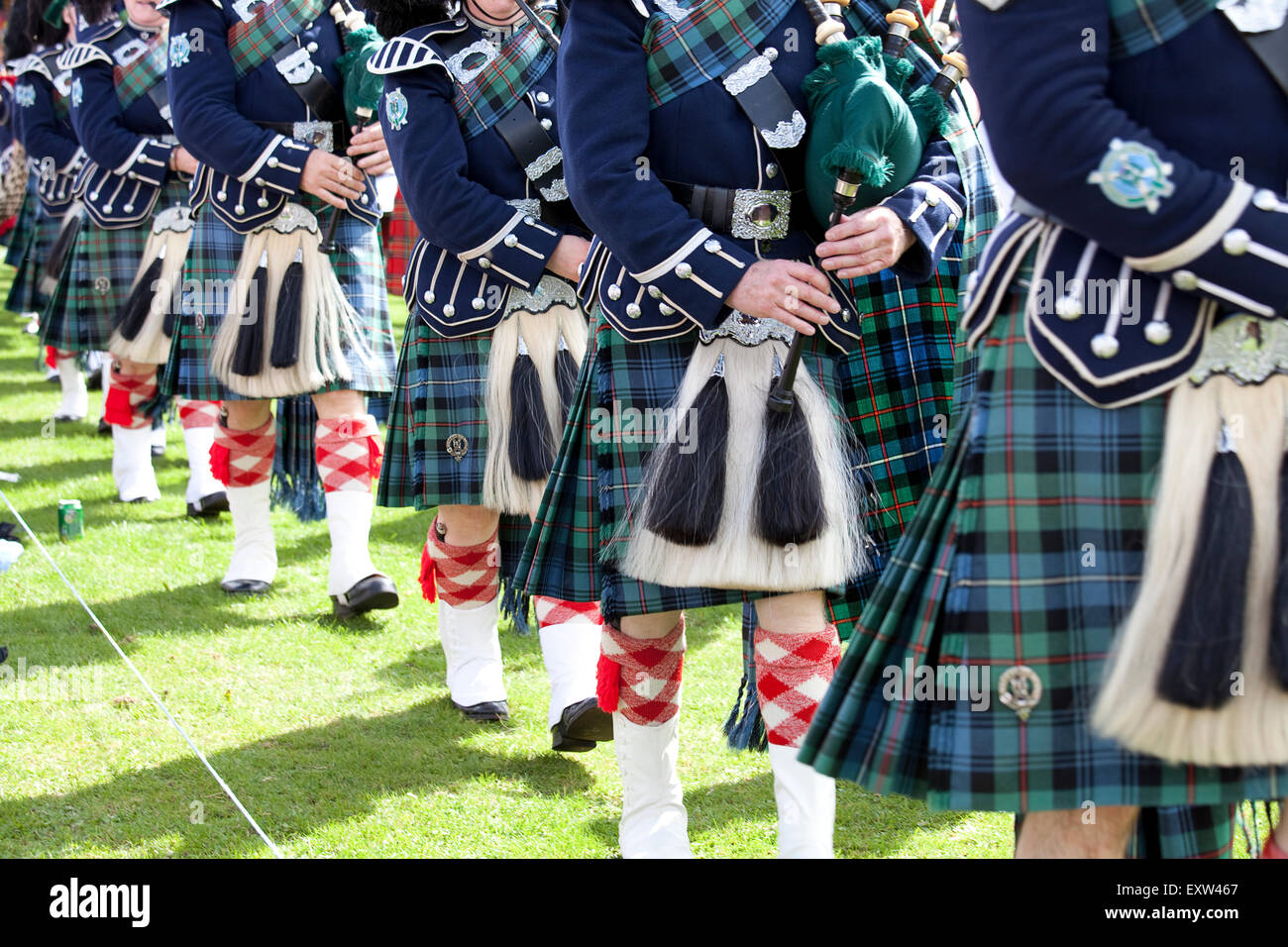 Ballater, Scotland - August 9th, 2012: Massed Pipe Bands at the Ballater Highland Games event in Scotland. Stock Photo