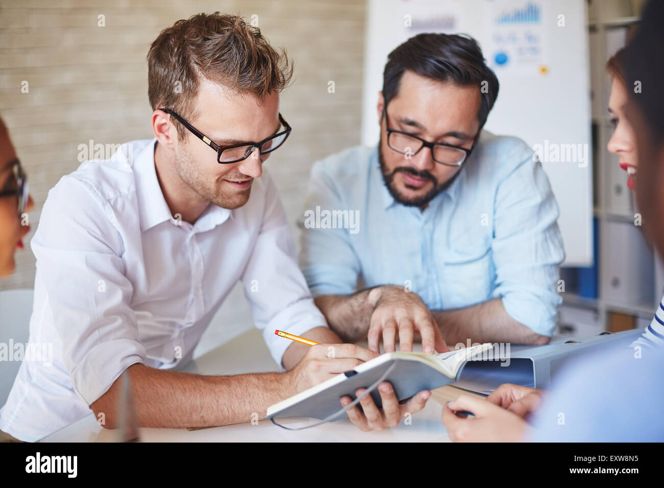 For Managers Meeting multi ethnic managers planning hi-res stock photography and ...